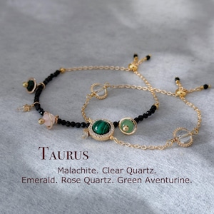 Può includere: Braccialetto zodiacale Toro con perline nere e dettagli dorati. Il braccialetto presenta pietre di malachite, quarzo trasparente, smeraldo, quarzo rosa e aventurina verde.