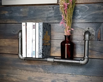 Industrial metal wall shelf. Wall bookcase for pocket books, DVDs, CDs. Interior decoration, office, living room