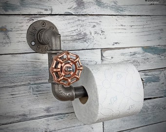 Original toilet paper holder. Metal toilet paper holder, Industrial style interior decoration.