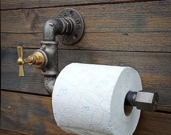 Industrial toilet paper dispenser. Original toilet roll holder, vintage interior decoration, plumbing, brass faucet