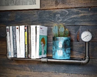 Industrial metal wall shelf with pressure gauge. Library for books, DVDs, CDs, Blu-rays, Video Games. Interior decoration
