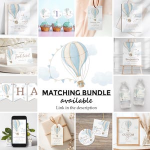 May include: A set of printable party decorations featuring a blue and white hot air balloon design. The set includes a banner, food labels, water bottle labels, thank you tags, cupcake toppers, and a sign. The text on the sign reads "Welcome to Benjamin's First Birthday".