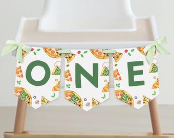 May include: A banner with the word "ONE" in green letters, decorated with pizza slices and green leaves. The banner is attached to a high chair with light green ribbons.