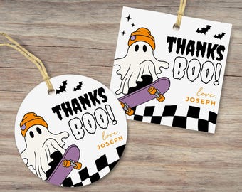 May include: Two white Halloween gift tags with a ghost wearing an orange beanie riding a purple skateboard. The tags read "THANKS BOO!" with "love, JOSEPH" in orange. Black bats and stars decorate the tags, with a black and white checkered pattern.