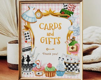 May include: A gold frame with a white background and pink and white checkered pattern. The text "Cards and Gifts" is in gold lettering. The image is decorated with Alice in Wonderland themed illustrations, including a teapot, cupcakes, playing cards, and a bottle labeled "Drink Me".
