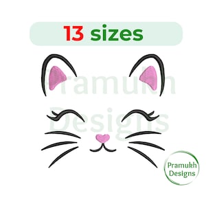 May include: A cat face design with black whiskers, eyelashes, and ear outlines. The inner ears are pink, and the nose is a pink heart. The text "13 sizes" is above the cat face, and the Pramukh Designs logo is in the lower right.