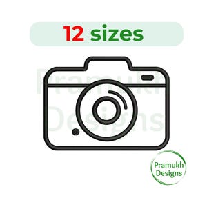 May include: Black and white line art of a camera with a lens and the text "12 sizes" in red and green. The camera design has a rounded lens and a small circle on the bottom left. A green circle with the text "Pramukh Designs" is in the bottom right.