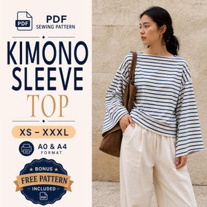 May include: A PDF sewing pattern for a kimono sleeve top with text reading KIMONO SLEEVE TOP, XS - XXXL, A0 & A4 FORMAT, and BONUS FREE PATTERN INCLUDED. The image shows a long-sleeved, white and navy blue striped shirt with wide sleeves.