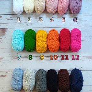 There are 18 color options for the cardigan. In order 1-white, 2-cream, 3-honey, 4-light pink, 5-pink, 6-lilac, 7-mint green, 8-green, 9-yellow, 10-orange, 11-red, 12-fuchsia, 13-light blue, 14-light grey, 15-grey, 16-black, 17-brown, 18-nawy blue