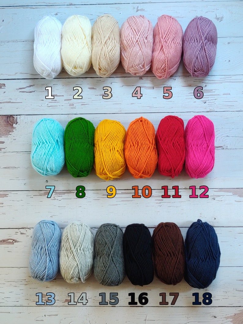 There are 18 color options for the cardigan. In order 1-white, 2-cream, 3-honey, 4-light pink, 5-pink, 6-lilac, 7-mint green, 8-green, 9-yellow, 10-orange, 11-red, 12-fuchsia, 13-light blue, 14-light grey, 15-grey, 16-black, 17-brown, 18-nawy blue