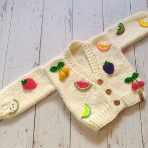 Side view of the baby fruity jacket for little girl birthday.