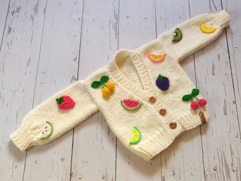 Side view of the baby fruity jacket for little girl birthday.
