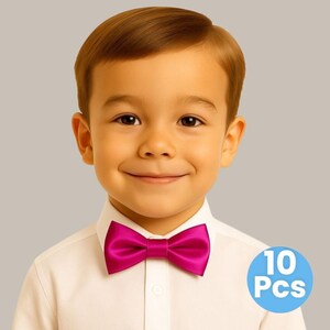 May include: A young person wearing a white button-down shirt and a bright magenta bow tie. A blue circle with the text "10 Pcs" is in the lower right corner. The bow tie is the focal point, adding a pop of color against the white shirt.