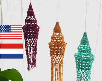 May include: Three crocheted macrame hanging lampshades in different colours: purple, orange, and teal. Each lampshade has a fringe of beads and tassels.