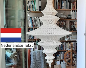 May include: A white crocheted macrame hanging lamp with a tassel. The lamp is hanging from the ceiling in a room with bookshelves and a spinning wheel.