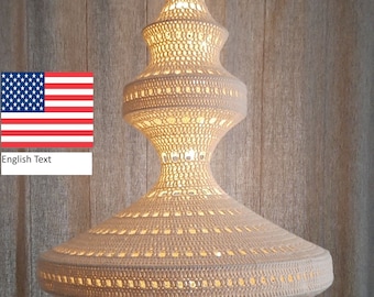 May include: A white crocheted pendant light fixture with a unique, modern design. The light fixture is shaped like a large, inverted teardrop with a smaller teardrop shape at the top. The light fixture is illuminated from within, creating a warm, inviting glow.
