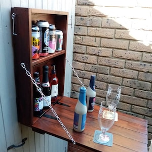 Fantastic Arty's Backyard bar made from reclaimed pallet wood, upcycled, recycled, rustic.