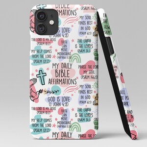 May include: White phone case with a colorful pattern of Bible verses and affirmations. The text includes "My Daily Bible Affirmations", "God is Love", "Faith can move mountains", and "The Lord is my rock".