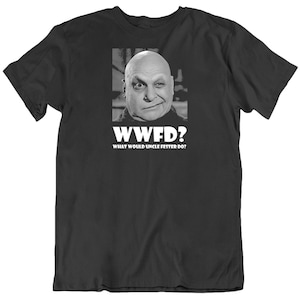 May include: Black t-shirt with a white graphic of a man's face and the text "WWFD? What Would Uncle Fester Do?"