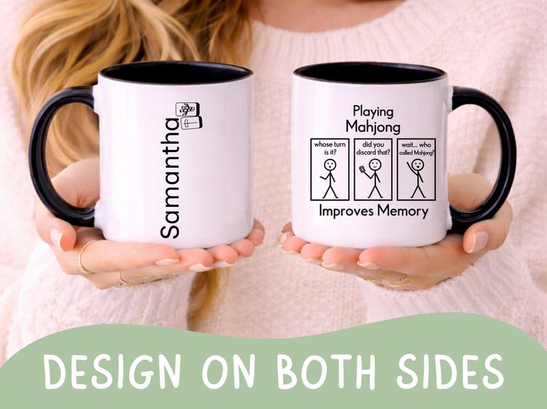 May include: White ceramic mug with a black interior and handle. One side features the name "Samantha" in black, and the other side has a Mahjong-themed design with stick figures and the text "Playing Mahjong Improves Memory."