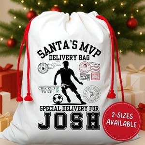 May include: White Santa's MVP delivery bag with red drawstring. The bag features a black graphic of a soccer player and the text "SPECIAL DELIVERY FOR JOSH". A red circle indicates two sizes are available.