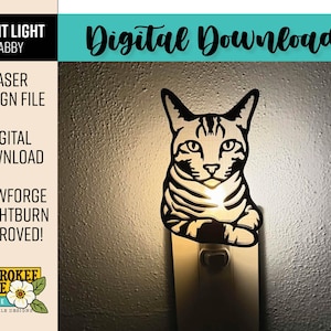 May include: A black laser-cut night light featuring a tabby cat design. The night light is plugged into a wall outlet and emits a soft glow. Text on the image includes "Night Light Tabby", "Laser Design File", and "Digital Download".
