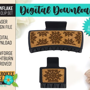 May include: Two sizes of black plastic hair claw clips with a wood-look design featuring a snowflake pattern. The design is laser cut and ready for use with Glowforge and Lightburn.