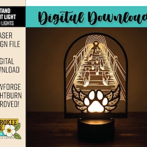May include: A laser-cut night light featuring a bridge with dog silhouettes, a paw print with wings, and the text "Digital Download". The light is illuminated by an LED, creating a warm glow. The design is approved for Glowforge and Lightburn.