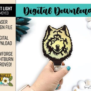 May include: A digital download laser design file for a Samoyed night light. The text reads NIGHT LIGHT SAMOYED, LASER DESIGN FILE, DIGITAL DOWNLOAD, GLOWFORGE + LIGHTBURN APPROVED!, and CHEROKEE ROSE BY KATIE LASER FILE DESIGNS. Features a dog head.