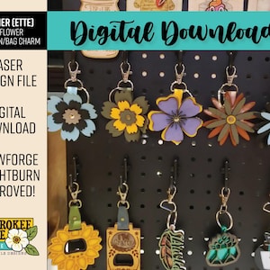 May include: A collection of multi-layered flower-shaped keychains and bag charms in various colours including blue, yellow, purple, and green. Each item features a metal lobster clasp and ring, displayed on a black pegboard with text overlays.