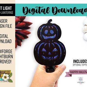 May include: A digital download laser design file for a night light featuring a stacked jack-o-lantern pumpkin motif. The black layered design displays cutouts with a blue and purple iridescent pattern. Text includes Night Light, Digital Download, Glowforge + Lightburn Approved, and Happy Halloween.