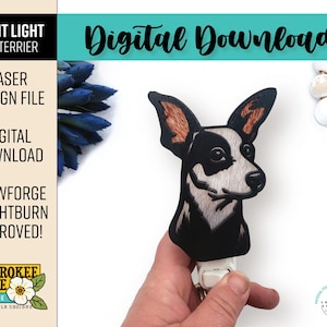 May include: A digital download file for a laser cut night light featuring a Rat Terrier dog. The design is black and white with brown accents. The file is compatible with Glowforge and Lightburn software. The image includes the text "Night Light Rat Terrier", "Laser Design File", "Digital Download", "Glowforge + Lightburn Approved!" and "Cherokee Rose by Katie Laser File Designs".