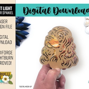 May include: A laser-cut night light featuring a Cocker Spaniel design. The light is held by a hand and has a light brown color with orange and yellow accents. The image includes text that says "Digital Download" and "Glowforge + Lightburn Approved!"