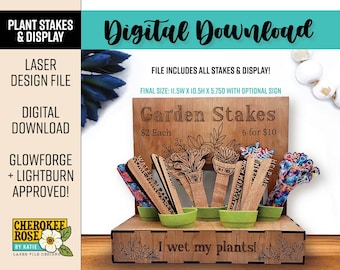 May include: A wooden garden stake display with the text "Garden Stakes" and "I wet my plants!". The display includes various plant stakes and small green pots. The final size is 11.5 inches wide, 10.5 inches high, and 5.75 inches deep.