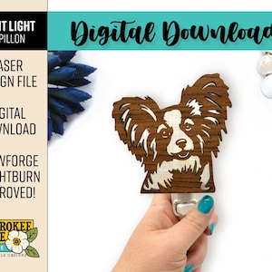 May include: A wooden night light featuring a Papillon dog design. The night light is brown with a light-colored face and ears. The image also includes text that says "Digital Download" and "Laser Design File".
