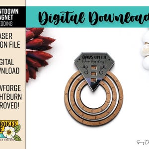 May include: A wooden countdown magnet shaped like a diamond ring with two rotating circular rings featuring numbers zero through nine. The top section is a silver-toned diamond shape with the engraved text "DAYS UNTIL Our big day!".