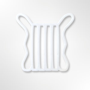 May include: White plastic mask holder with five vertical slots and two loops at the top.