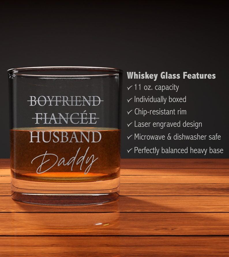 May include: A clear glass whiskey tumbler with the words "Boyfriend, Fianc&eacute;e, Husband, Daddy" etched on the side. The glass has an 11 ounce capacity and is individually boxed. It is chip-resistant, laser engraved, microwave and dishwasher safe, and has a perfectly balanced heavy base.
