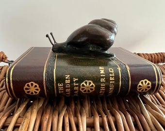 Vintage Paperweight The Garden Party Decorative Book with Bronze Snail sitting On Top