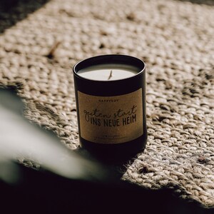 Scented candle with saying A good start to the new home Soy wax candle in black glass image 2