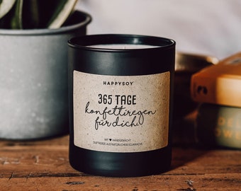 Scented candle with saying | 365 days of confetti rain for you. | Soy wax candle in black glass