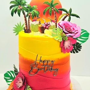 May include: A tropical-themed birthday cake with a gradient of yellow, orange, and pink frosting. The cake is decorated with palm trees, coconuts, flowers, and a 'Happy Birthday' topper. The cake sits on a white plate.