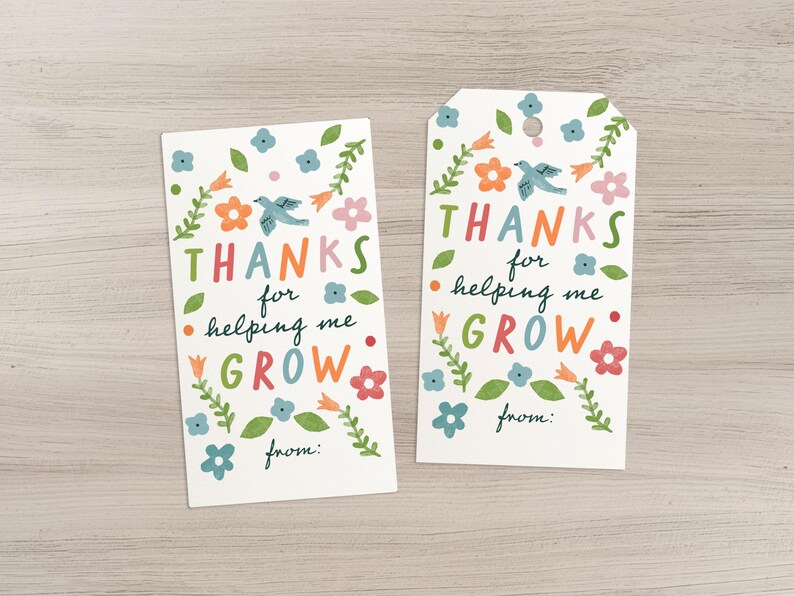 May include: Two white gift tags with colorful floral and bird illustrations. The tags read "THANKS for helping me GROW" in a playful font. One tag is rectangular, the other has a rounded top. Both have a space for "from:"