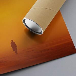 May include: A silhouette of a person walking on a sandy beach with a sunset in the background. The sky is a gradient of orange, yellow, and red.