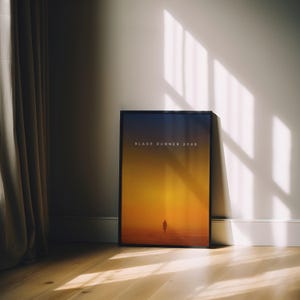 May include: A black framed poster with a yellow and orange gradient background. The text "BLADE RUNNER 2049" is at the top of the poster. A silhouette of a person is walking in the distance.