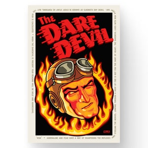 May include: A vintage-style poster with a bold red and black color scheme. The poster features a cartoon illustration of a daredevil wearing a helmet and goggles, surrounded by flames. The text "The Dare Devil" is written in a stylized font.