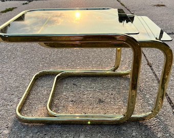 Pair of Modern Brass Nesting Tables With Smoked Glass Top Mid Century Style Attributed to Milo Baughmann 1970s Disco Decor Vintage MCM Decor