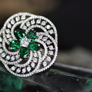 Turning Sun Waves Cocktail Ring with Vivid Green