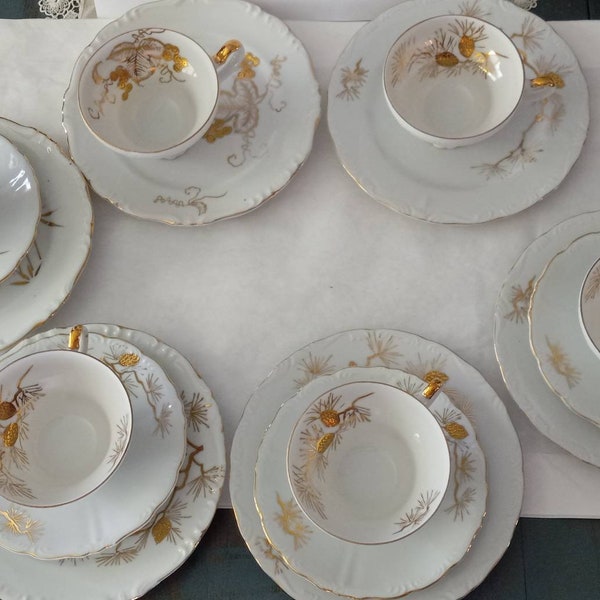 ROYAL CARLTON antique tea cups and plates. Pine cones and bamboo in gold decorate this very pretty set of six cups and and six snack plates.