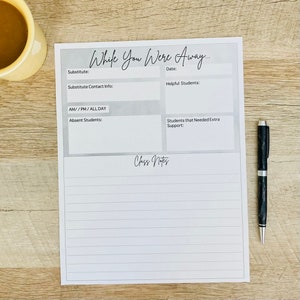 May include: A white paper form titled While You Were Away with sections for substitute information, date, helpful students, absent students, and students needing extra support, plus a lined section for class notes, accompanied by a black pen.